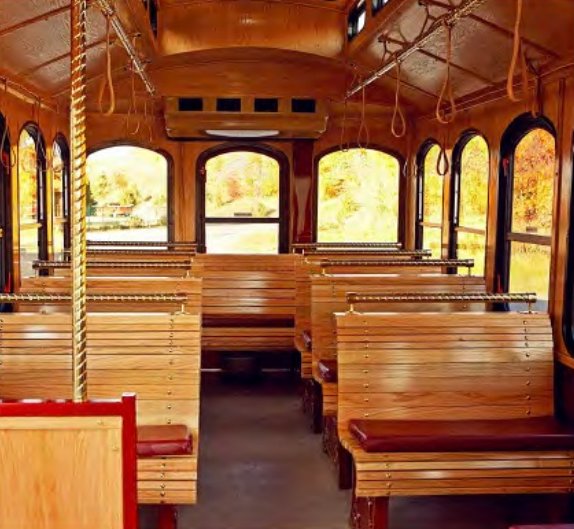 Carriage trolley interior with hardwood benches